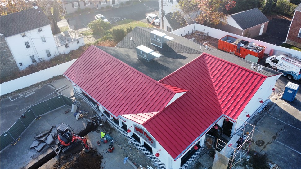 United Veterans Roofing crew on an OSHA-compliant, staged and secured commercial roofing jobsite