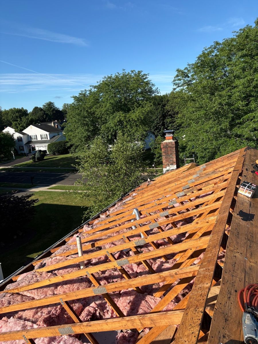 Roof stripped down to the rafters during a full re-deck in Newtown